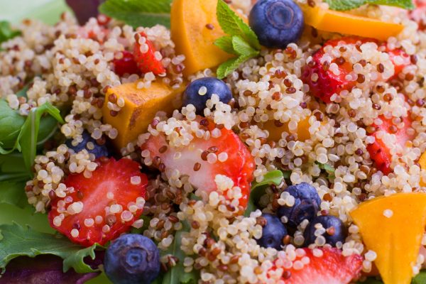 quinoa severed with strawberry and blueberry